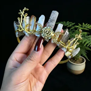 Detailed view of handmade gold crystal tiara headband with moon and rose elements for women.