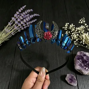 Exquisite handmade blue crystal crown headband with hollow moon and red rose details.