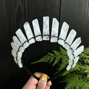 Close-up view of the raw crystal quartz crown headband with black wire details.
