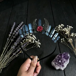 Crystal headband detail showing raw blue crystals, hollow moon and red rose crown close up.