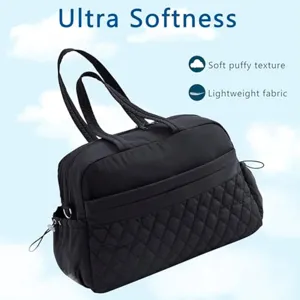 Black quilted travel duffel bag lightweight soft puffy fitness tote detail view feature.