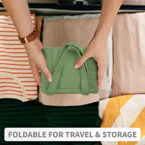 Detail view of a green foldable canvas tote bag, perfect for travel storage and daily use.