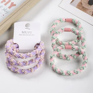 Detailed view of thick metallic hair ties, high elasticity elastic bands for stylish ponytails.