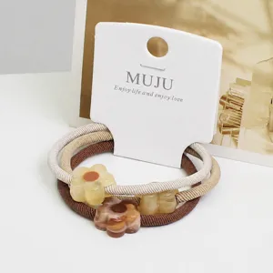 High-end 3-piece carded hair ropes with resin flower charms, high elasticity twill rubber bands.