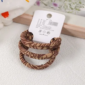 3-piece carded seamless hair ties featuring trendy brown leopard print knit design for daily styling.