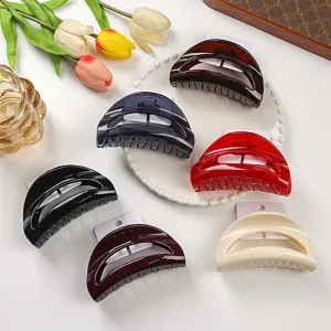 Detailed view of fashionable crescent hair claws in multiple colors with elegant styling.