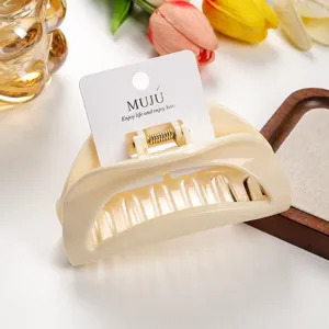 Cream crescent hair claw clip, stylish PC plastic hair accessory with card packaging, elegant design.