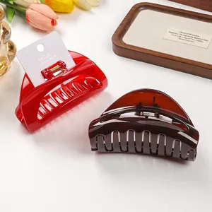 Detail shot of high-end PC crescent hair claw, thick shark clip for daily hair styling.