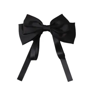 Elegant black satin hair bow clip with long ribbons for women and girls hair styling.