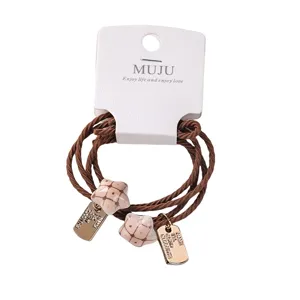 2-pack brown braided hair ties with ceramic star charms and cards for daily styling.