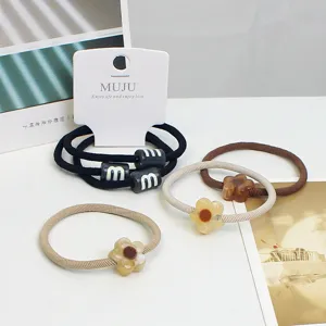Fashion stylish hair scrunchies set featuring cute floral and letter bead designs for women.