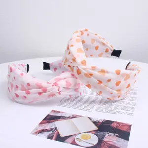 Set cerchietto per capelli in tessuto con cuori, accessorio elegante e antiscivolo donna.
