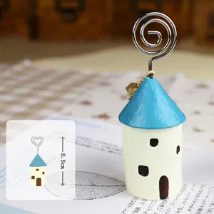 Creative Mediterranean wooden house memo clip with spiral wire stand for desktop decor photo.