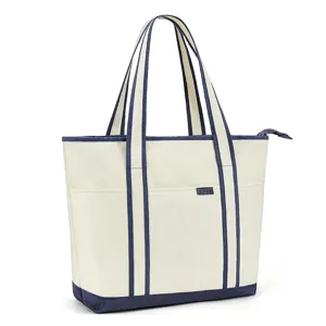 Detailed view of the canvas tote bag showing the front pocket, sturdy straps, and zipper.