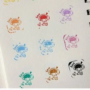 Cute cartoon character stamp pad ink imprint for DIY journaling and scrapbooking decoration.