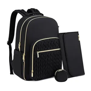 Black diaper backpack set with gold zippers, quilted front pocket and portable changing pad.