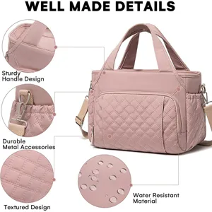 Pink quilted lunch bag detail view showing water-resistant fabric, sturdy handle and hardware.