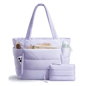 Detailed view of the lightweight purple puffer tote bag with multi-compartments and matching pouch.