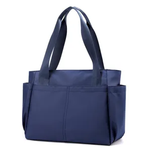Casual navy blue nylon tote bag, lightweight shoulder handbag with multiple pockets for daily use.