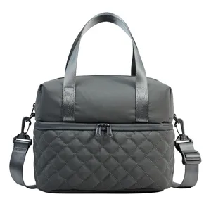 Quilted insulated lunch bag for women, waterproof nylon crossbody tote cooler detail.