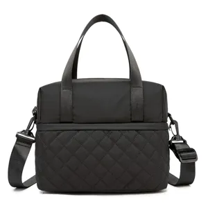Black quilted insulated lunch bag with handles and crossbody strap for daily use.