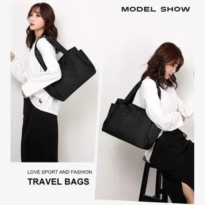 Detailed view of black travel tote bag with dual shoulder straps and handy outer side pockets.