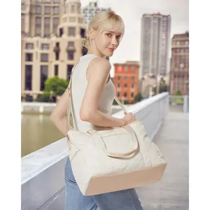 Chic quilted tote bag for women, lightweight casual shoulder bag with zipper and comfortable handles.