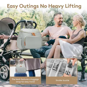Compact grey diaper backpack with stroller straps and luggage sleeve for effortless travel.