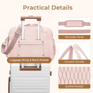 Close-up view of pink quilted travel duffel bag showing luggage sleeve and shoulder strap