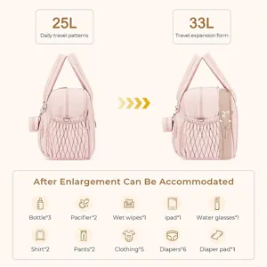 Pink diaper bag for travel with expandable 33L capacity and multiple storage compartments.
