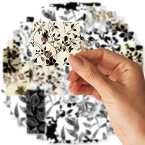 Floral washi tape detail showing brown and black vine pattern for DIY journaling and crafts.