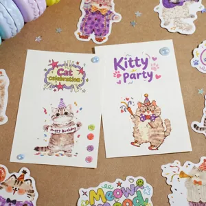 Detailed view of cute cat celebration stickers, featuring birthday and party themes for handbook decoration.