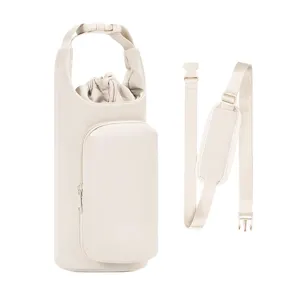 Insulated tumbler carrier bag detail with crossbody strap and front pocket for outdoor travel.