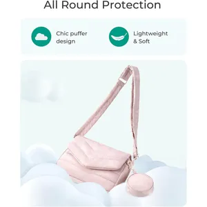 Pink quilted crossbody bag detail featuring adjustable strap and small round coin purse.