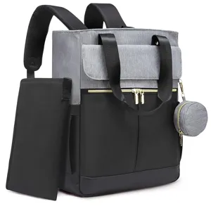 Detailed close-up of the grey and black diaper backpack with functional pockets and handles.