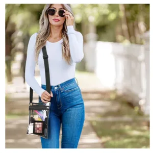 Clear crossbody bag for stadium events, transparent PVC purse with adjustable strap.