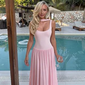 Detail view of stylish pink sleeveless spliced pleated long dress for summer outdoor wear.