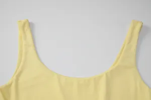 Essential yellow scoop neck dress detail, soft fabric, elegant sleeveless design for women fashion.
