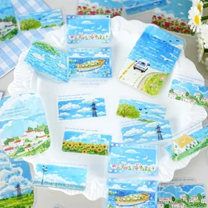 Close-up detail of healing blue sky landscape decorative stickers for DIY journal craft.