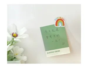 Creative cute memo pad detail showcasing daily inspirational quotes and colorful lovely artwork.