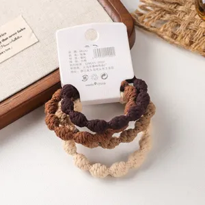 Detailed view of the 4-pack brown thick elastic hair ties set, stylish hair accessory card.