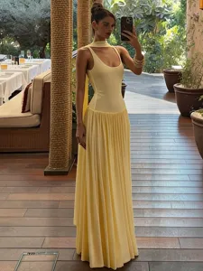 Women yellow slim fit long tank dress with pleated skirt and elegant neck scarf ribbon.