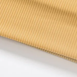 Detailed macro shot of yellow ribbed knit athletic headband fabric, soft, elastic, sweat-wicking.
