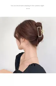 Chic gold metal hair claw clip with minimalist geometric rectangle design for elegant daily wear.