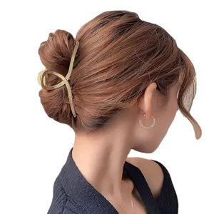 Matte gold geometric metal hair claw clip main view, elegant styling accessory for women.