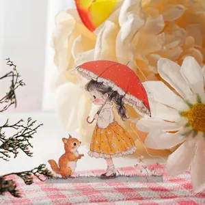 PET sticker detail showcasing a cute girl with red umbrella and a small squirrel design.