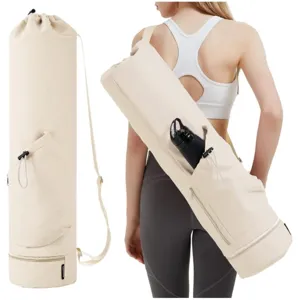 Beige yoga mat carrying bag detail showing adjustable shoulder strap and water bottle pocket.