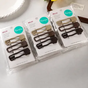 Set of 3 minimalist metallic hair clips in chic nude and brown shades for elegant styling.