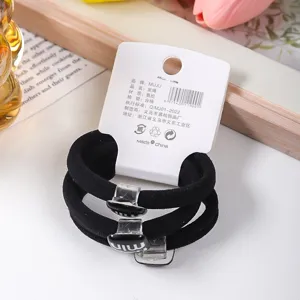 Black elastic hair ties set with stylish metal decor, durable and gentle on hair daily use.