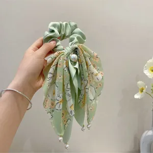 Korean elegant floral hair scrunchie with long ribbon tails and pearl pendants for women.